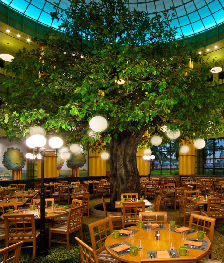 Garden Grove Restaurant with Tables, Chairs and a Large Tree at the Walt Disney World Swan Resort