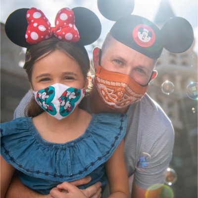 Dad and Daughter Wearing Masks and Disney Ear Hats
