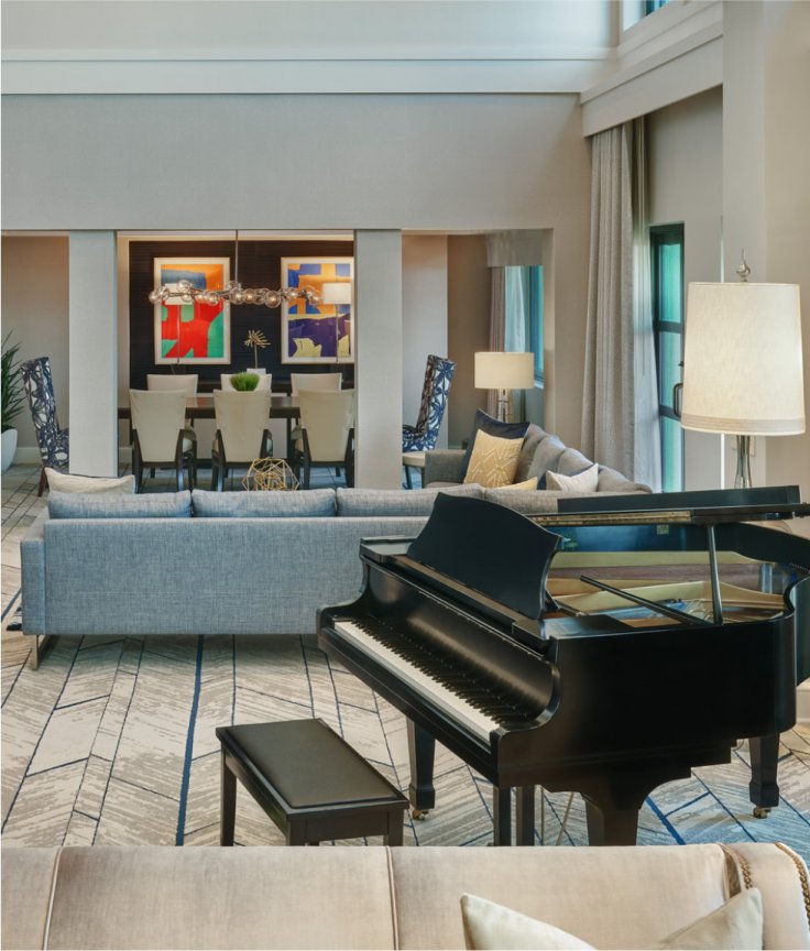 Presidential Suite Sitting Area with Couches, Chairs and Grand Piano at the Walt Disney World Dolphin Resort