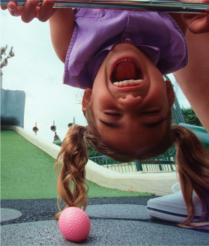 Girl Having Fun Playing Goofy Golf