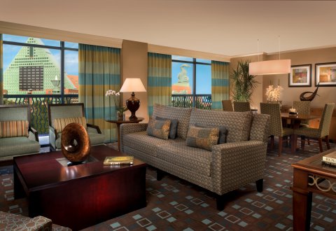 Governors Suite Living Room with Couch, Chairs, Tables and Dolphin Hotel in the Background