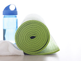 A Yoga Mat, a Towel and a Water Bottle