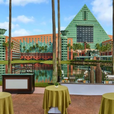 Reception Set Outside with Round Tables and Dolphin Hotel in the Back