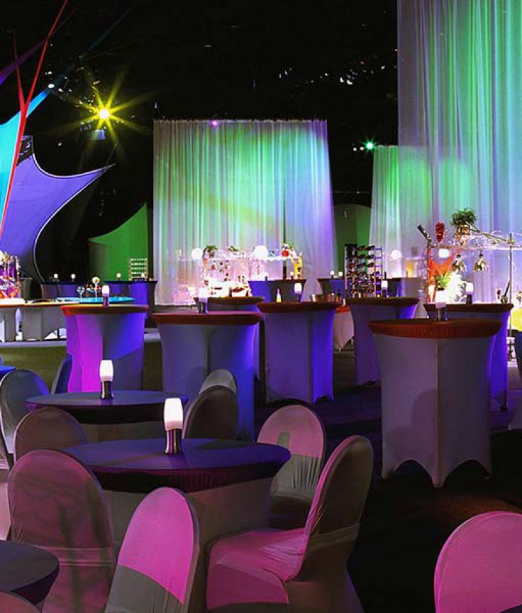 Banquet Set-up with Tables, Chairs and Multicolored Background