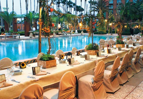 Tables and Chairs Set for a Dinner Event by the Pool