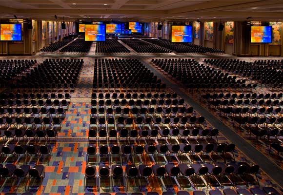 Very Large Ballroom with Thousands of Chairs and Very Large Screens