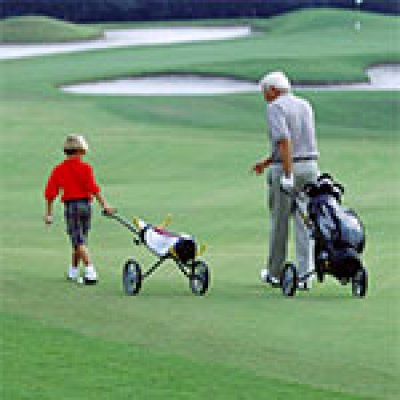 Father and Son on Greens at Walt Disney World World Championship Golf