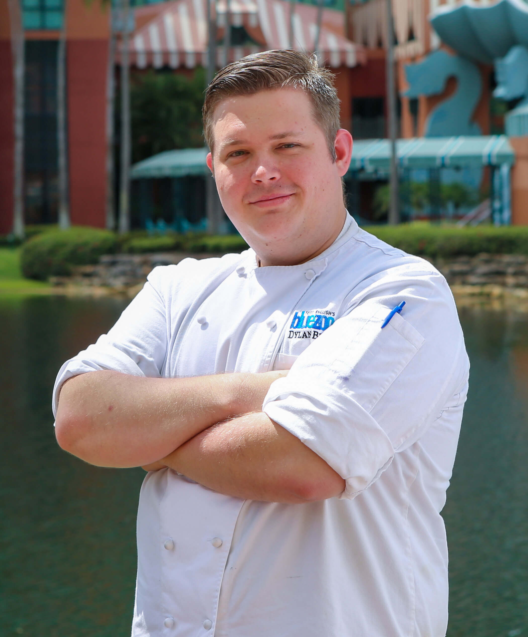 Chef Dylan with Hotel in the Background