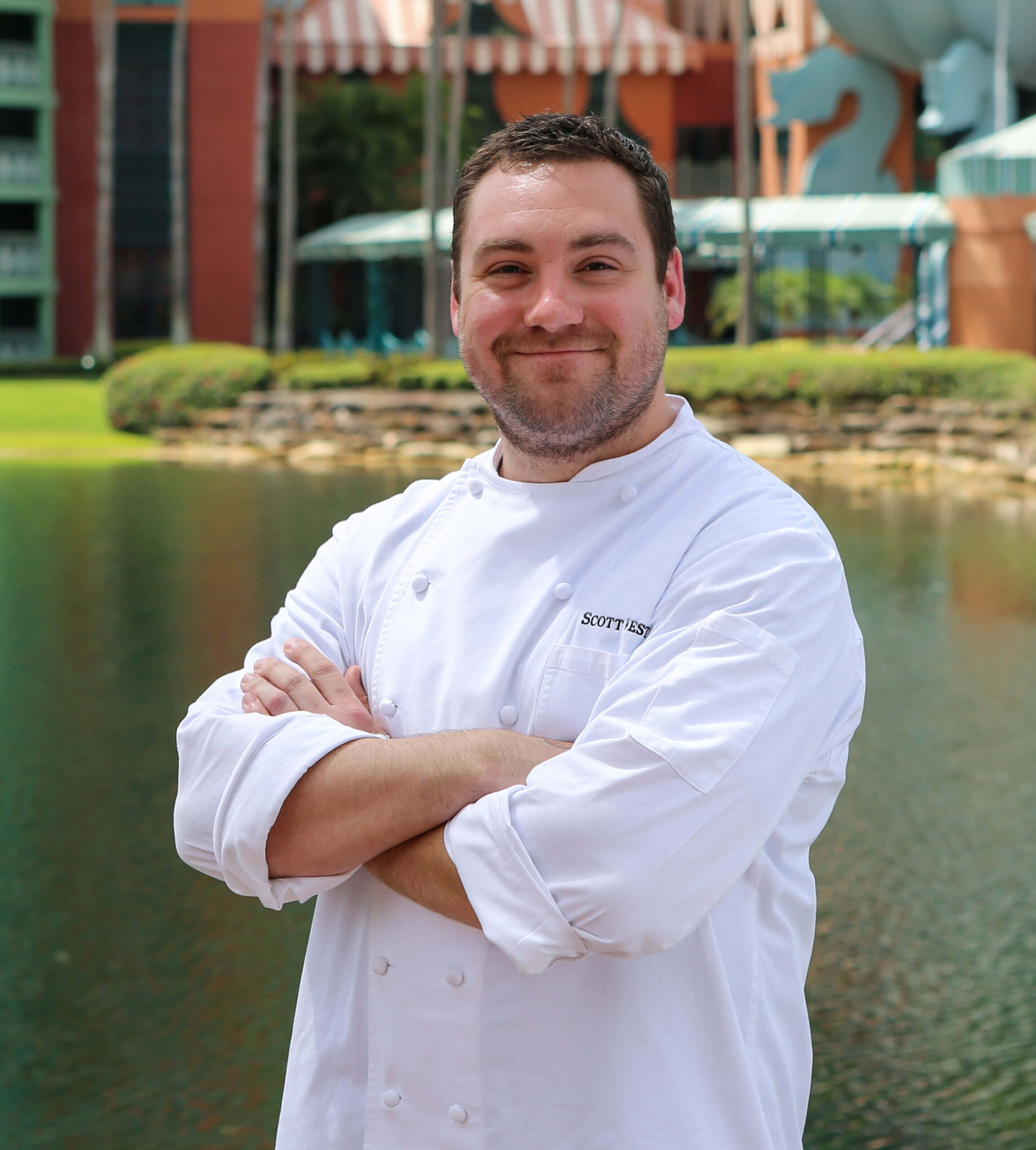 Chef Scott with Hotel in the Background