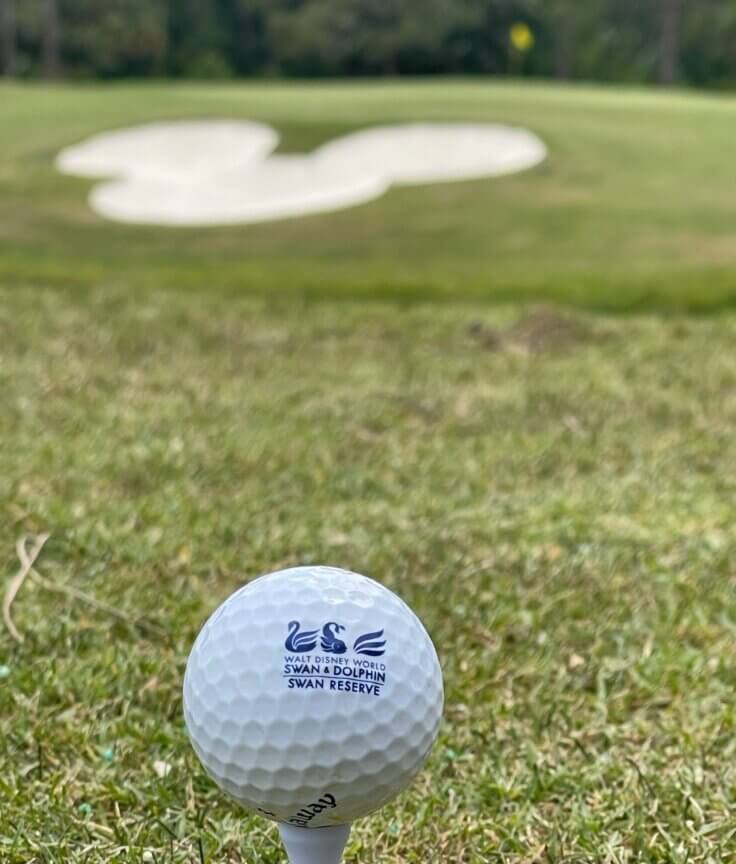 Swan and Dolphin golf ball with a Mickey ear shaped sand trap.