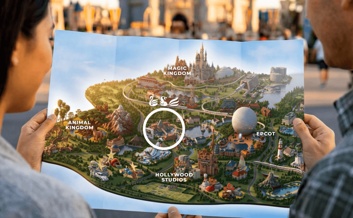 Two people hold an illustrated map of Walt Disney World Resort, with a circle highlighting the Swan and Dolphin hotels.